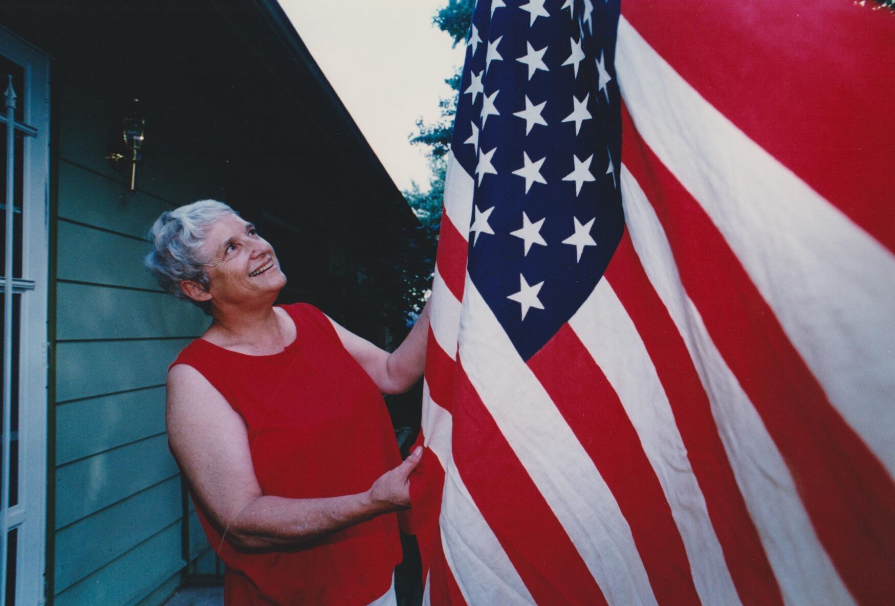 Patricia Vondra with the flag, 1995